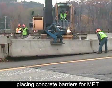 traffic may be stopped while handling the concrete barriers